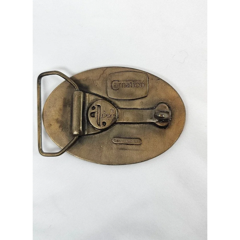 Vintage 1977 Carnation Calf Manna Solid‎ Brass Belt Buckle Award Design
